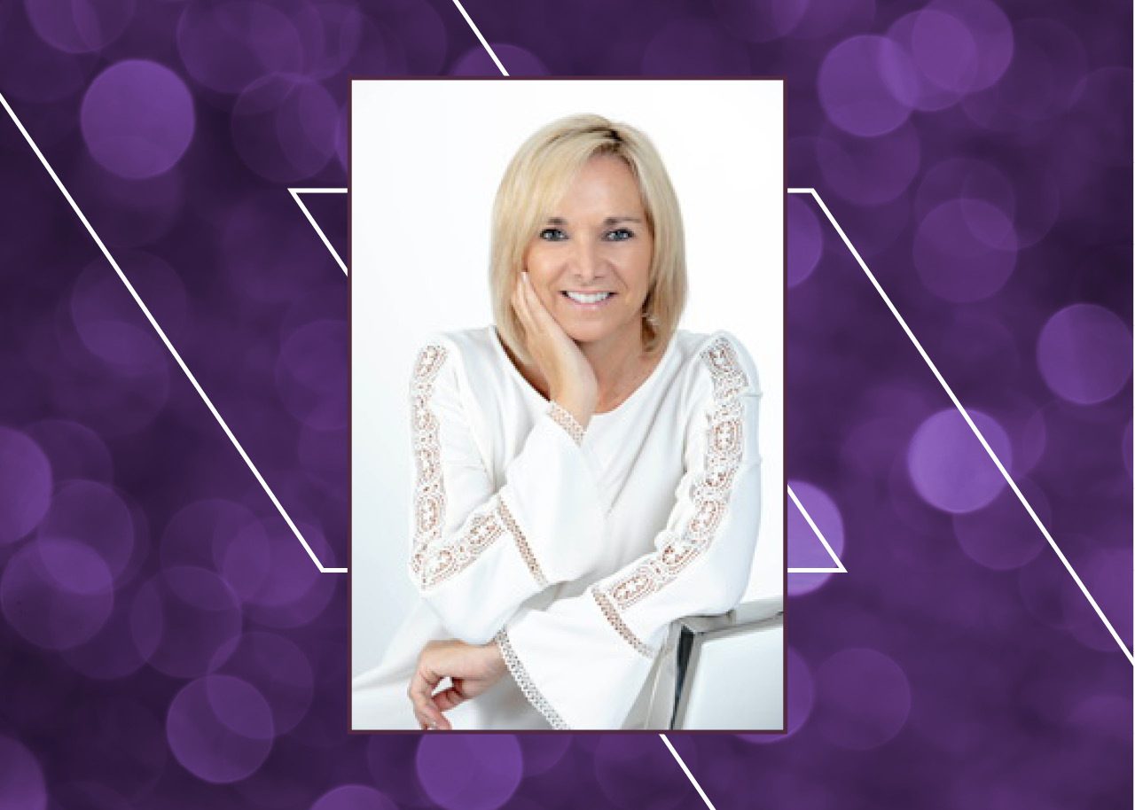 Christina Karas headshot on purple bokeh background